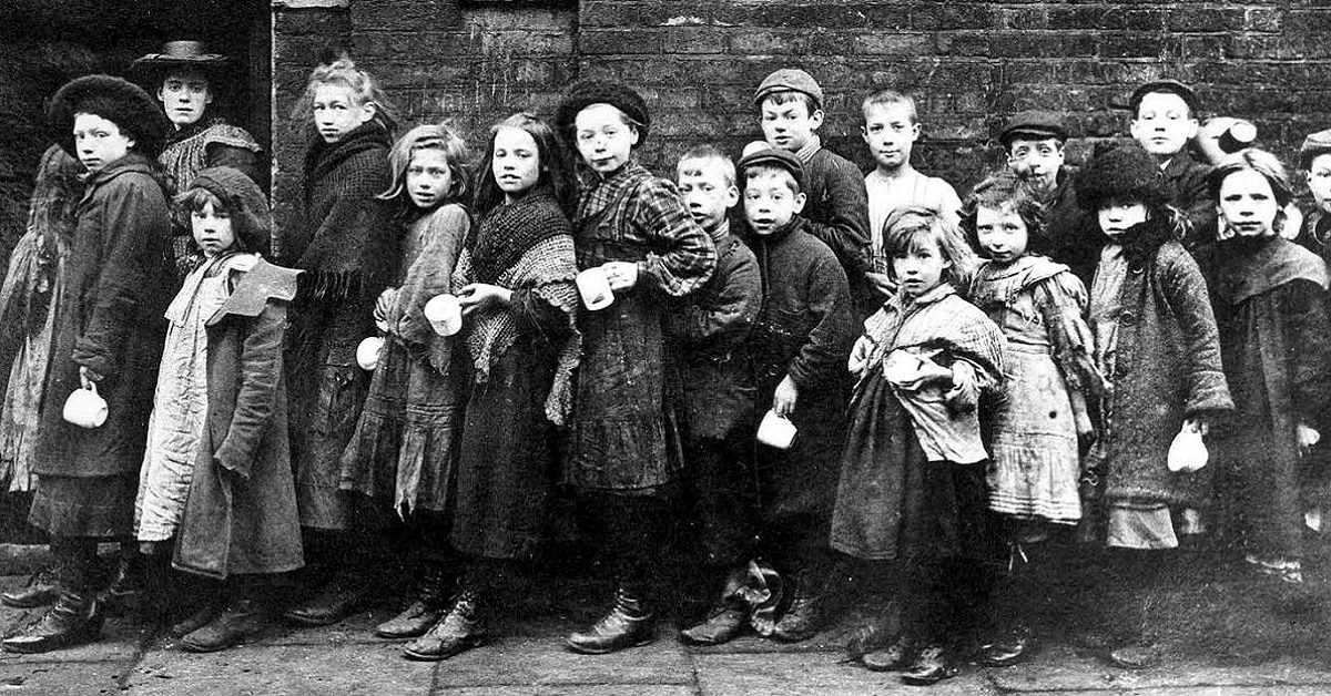 A court in Whitechapel and some of its children inhabitants