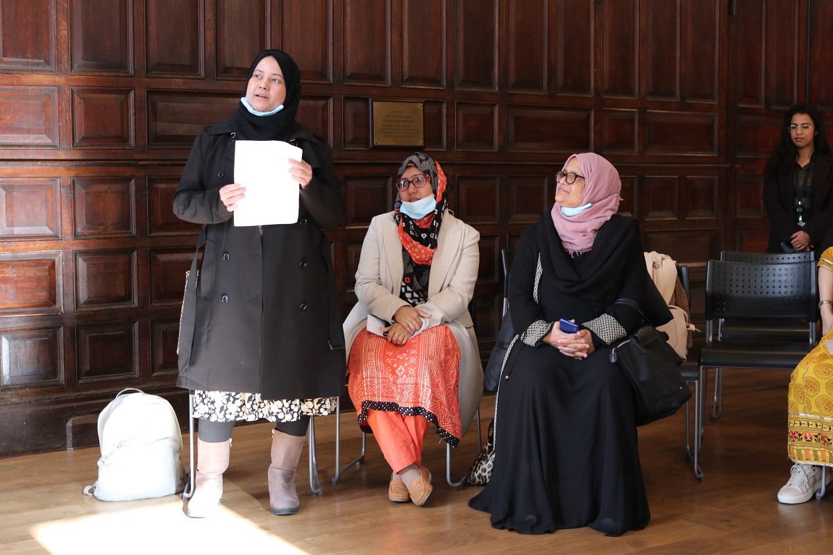 Women speaking in the hall