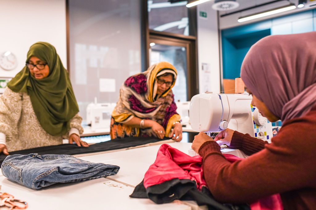 Photo of a sewing class in the Community Centre