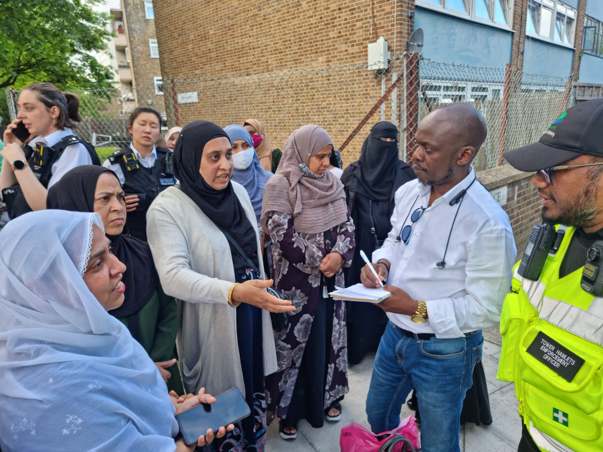 Local people discussing community safety with Tower Hamlets enforcement officers