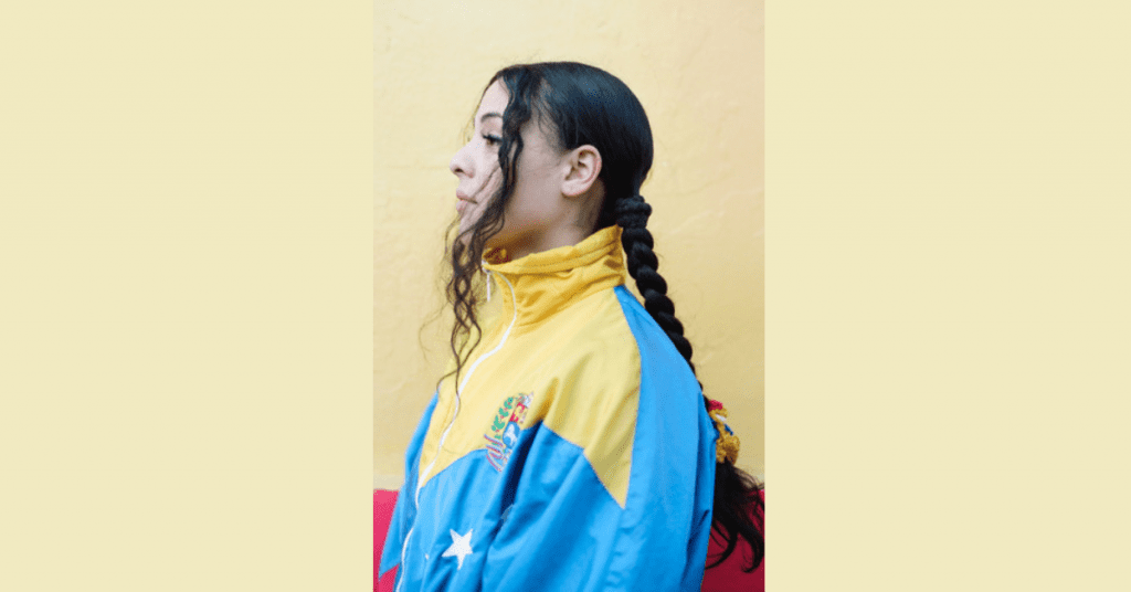 head shot of author Priscila Hernandez, Project officer on Thrive LDN’s research & evaluation team. Photographed wearing a Venezuelan flag inspired jacket.