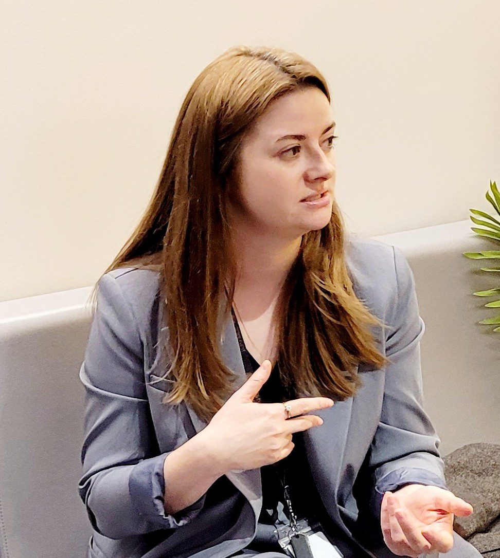 Young woman talking to someone out of shot